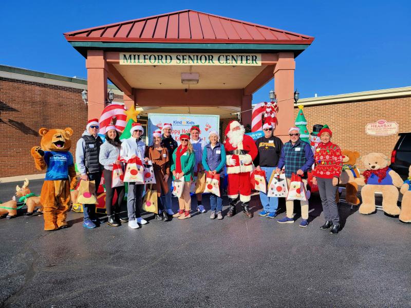 The Bay to Beach Builders team distributes toys to children in foster care at Kind to Kids Foundation’s holiday toy party drive-thru event. Shown are (l-r) Trey Jewell, Sarah Wilson, Chase Marvil, Carley Lord, Remy Haynes, Carla Parker, Brooks Parker, Sheryl Neighoff, Santa aka John Zotcavage, Curt Enerson, Deric Parker and Caroline Jones from the Kind to Kids Foundation. SUBMITTED PHOTOS